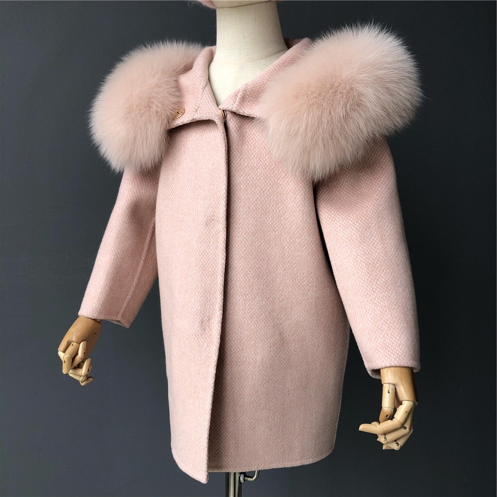 A light pink cashmere and fur coat called designed by MVFURS.