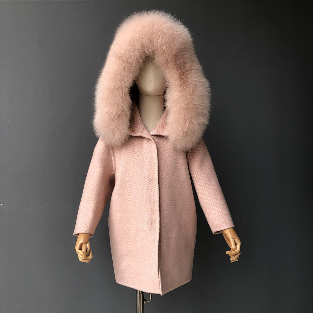 A light pink cashmere and fur coat called designed by MVFURS.