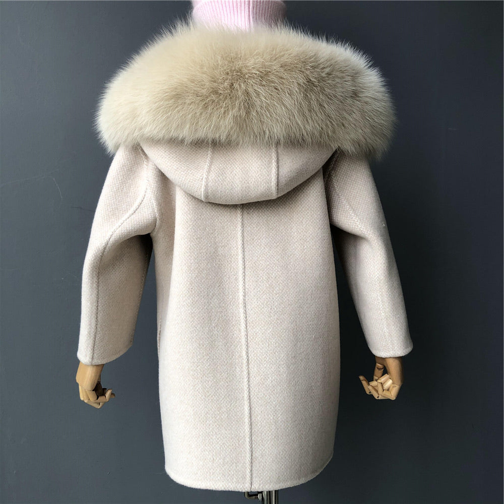 A beige cashmere and fur kid coat designed by MVFURS.