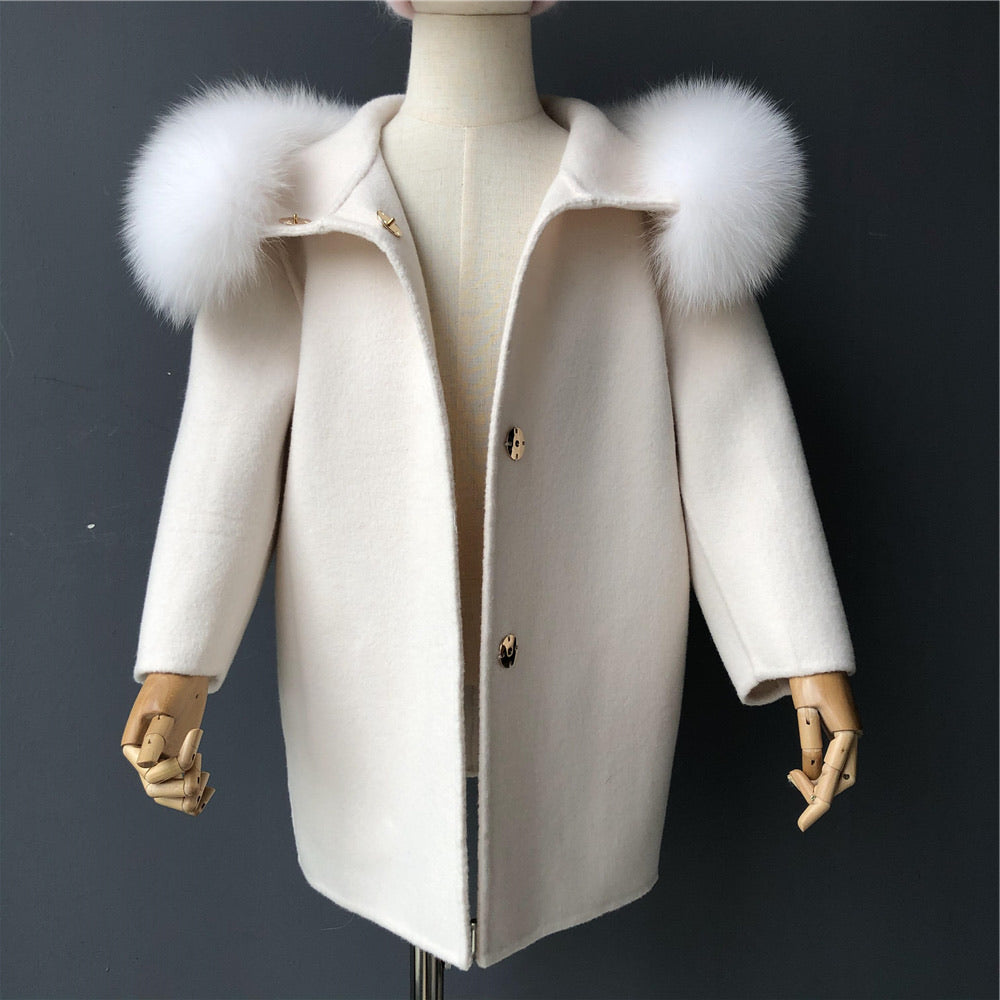 A nude cashmere and fur kid coat designed by MVFURS.
