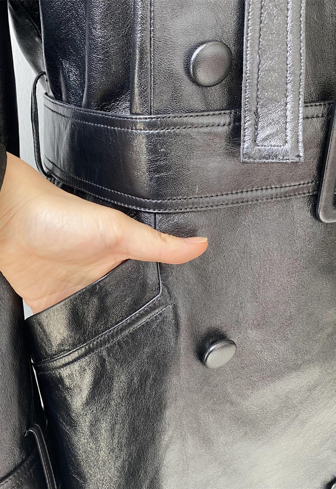 Close up detail of a leather trench coat for woman. 