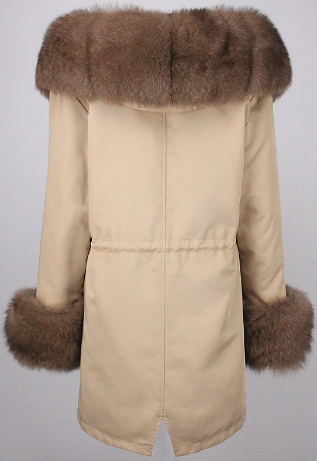 A stylish beige hooded parka with luxurious brown fox fur trim and fur cuffs. The parka’s design balances elegance and practicality, making it a perfect choice for winter outings.