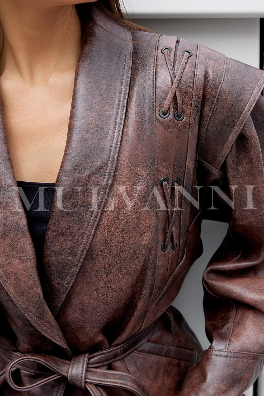 Close up of a brown leather jacket. 