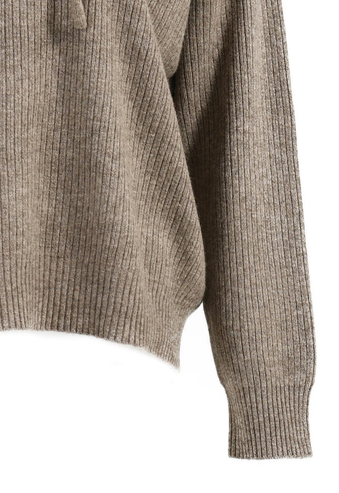 Close-up of a taupe-colored Chai Cashmere Tracksuit sweater, showcasing its soft and luxurious cashmere wool fabric.