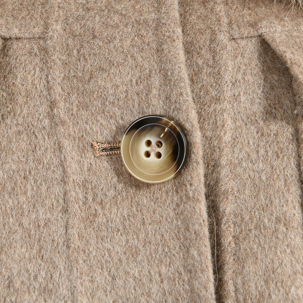  Close up of a cashmere coat for woman showcasing the high quality wool. 