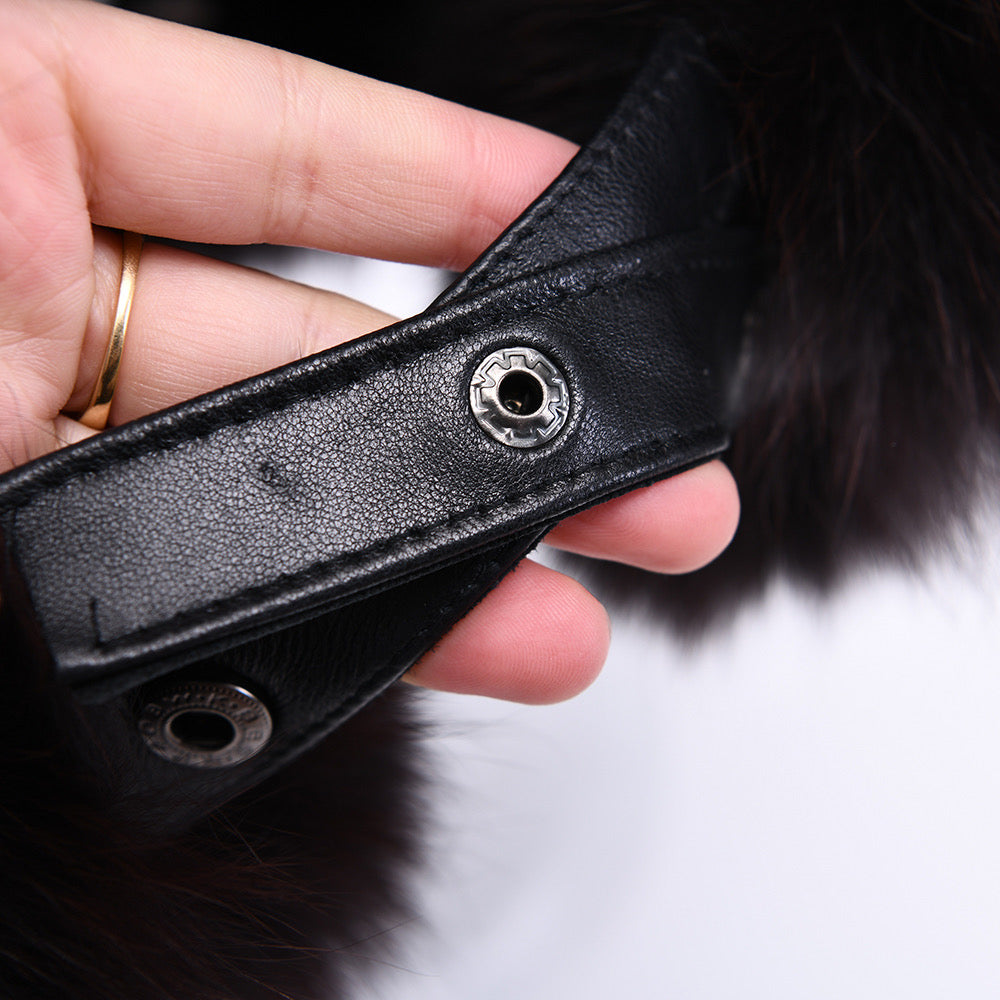 Close up of leather fur hat for woman showcasing the leather. 