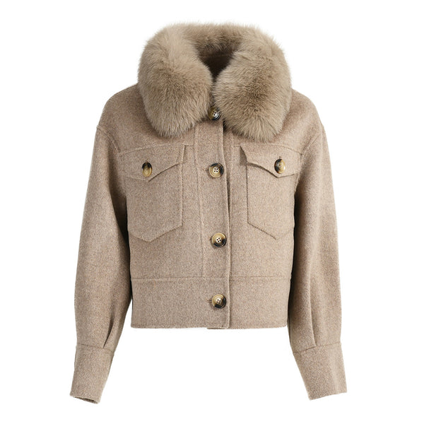 A taupe cashmere coat for women, featuring a luxurious texture and a sophisticated fox fur collar. The coat has a tailored silhouette with elegant button-front closure, combining warmth and style for a refined look.