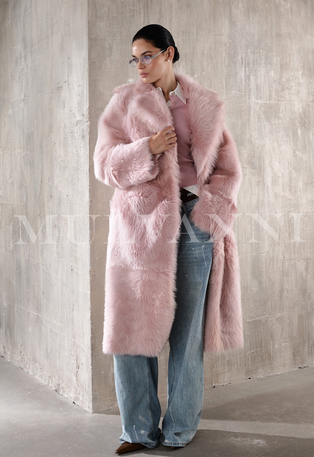 A stylish pink long shearling coat for women, ideal for adding a pop of color to cold-weather outfits.