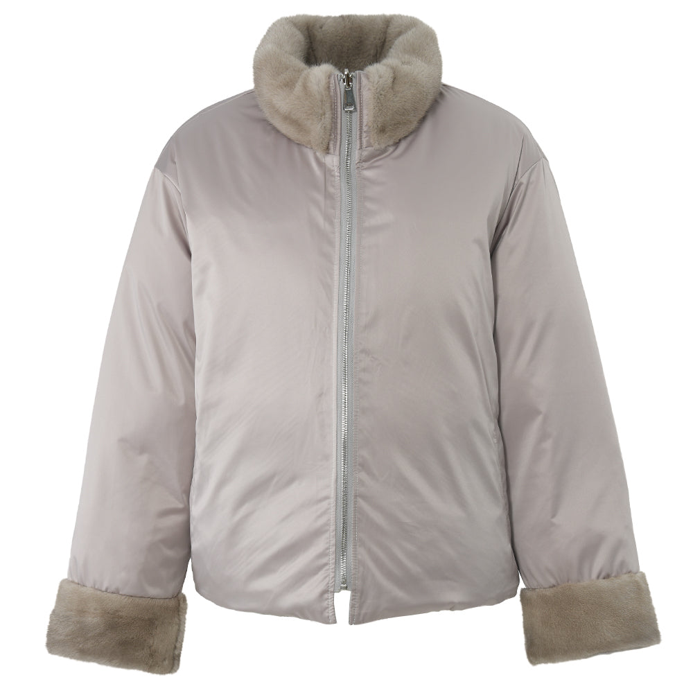 A sophisticated reversible wool down puffer jacket with a soft mink fur neck detail. The combination of materials offers a stylish and warm option for winter, perfect for various occasions.