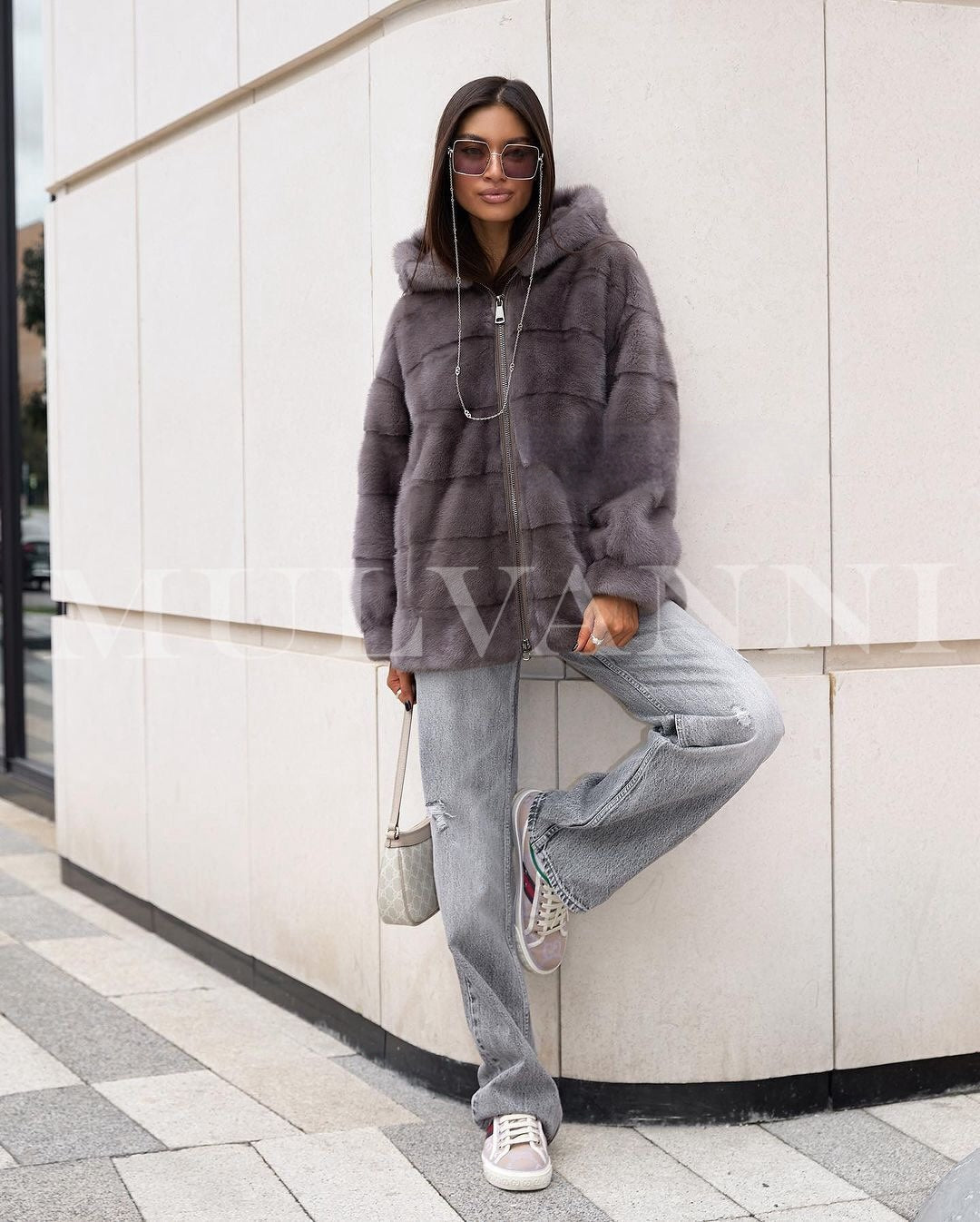  Women's grey mink short coat with a soft, velvety feel and am hood. The coat has a classic collar, cropped length, and a refined look, perfect for adding a touch of luxury to any outfit.