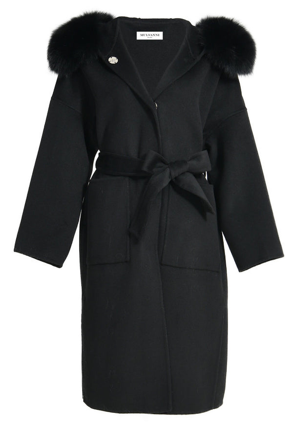 A long black cashmere coat featuring a cozy hood trimmed with luxurious fox fur and a stylish belt. The coat combines warmth and elegance, making it a sophisticated choice for winter wear.