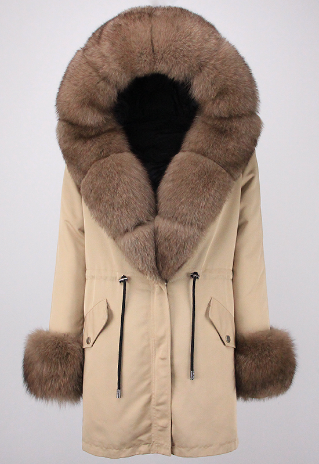 A beige hooded parka featuring elegant brown fox fur trim and fur cuffs. The parka combines a soft color palette with luxurious fur details, offering both warmth and a stylish winter look.