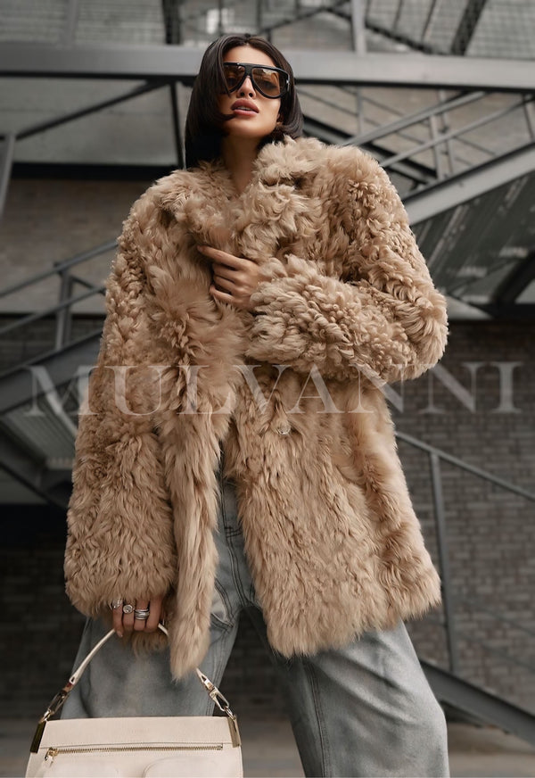 Woman wearing ADRIE Ecru Shearling Coat, showcasing premium quality and luxurious texture, perfect for daily wear in cooler weather.