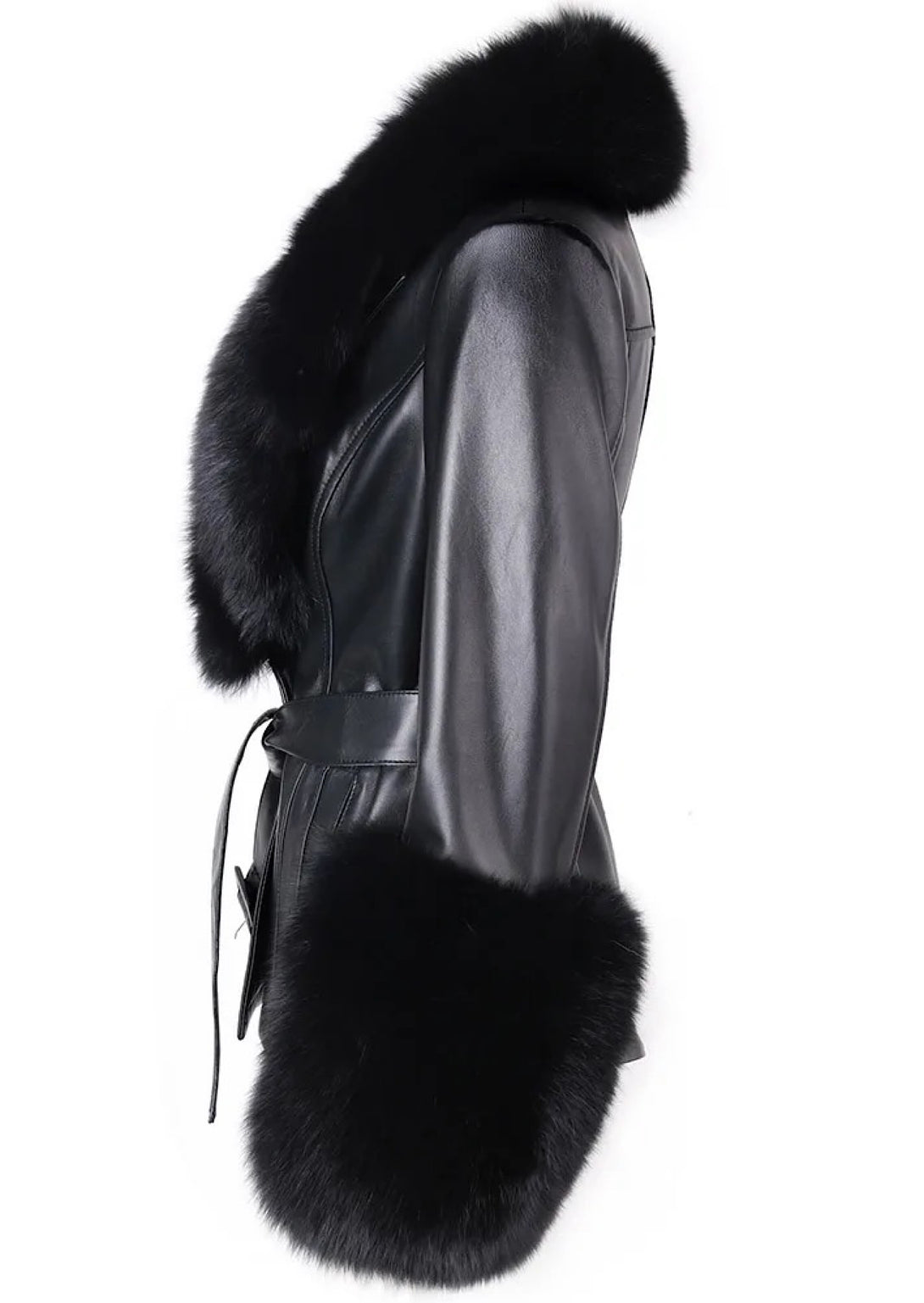 A woman wearing a black leather short jacket adorned with luxurious black fox fur cuffs and a dramatic collar. The jacket’s sleek design adds sophistication and warmth to her outfit.