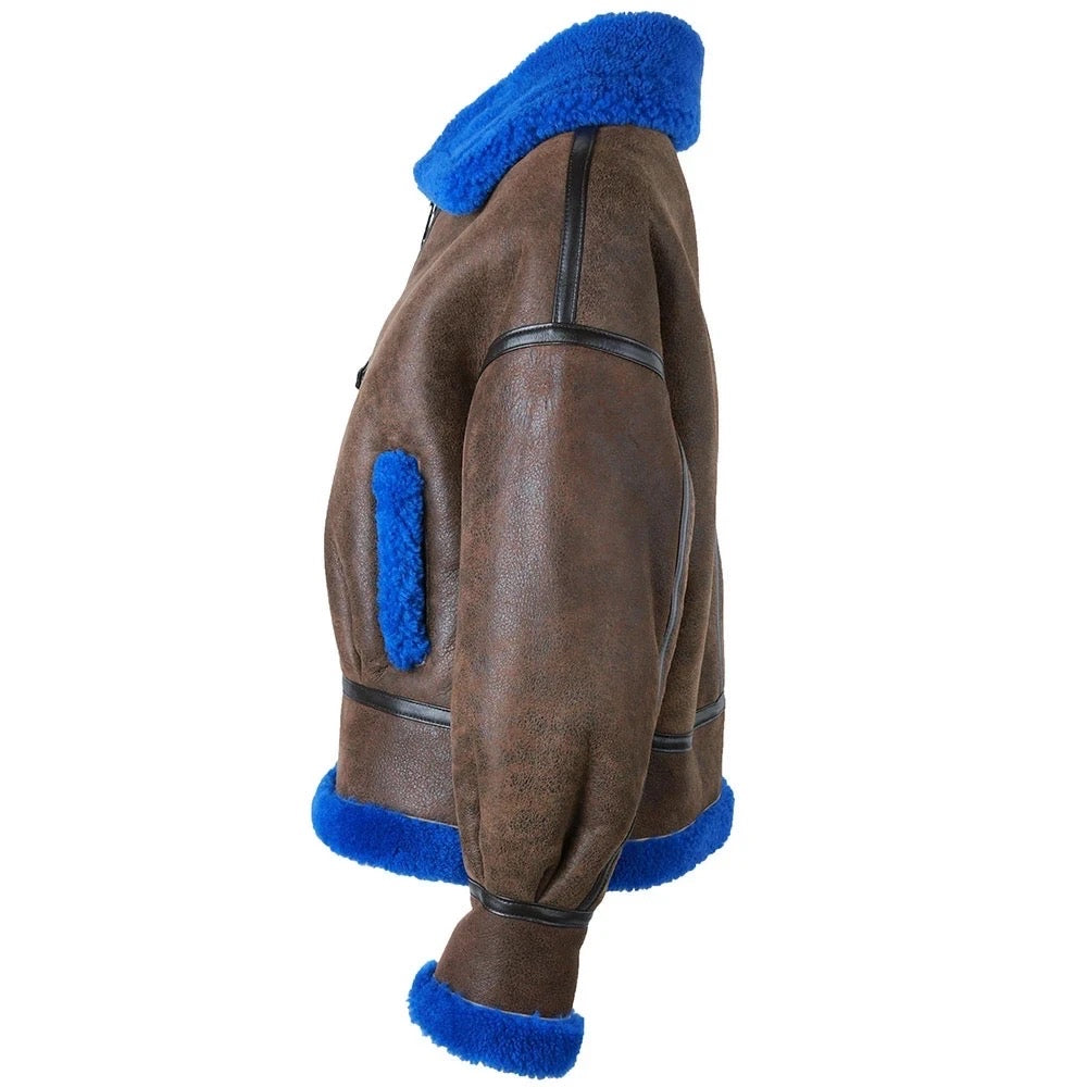 The brown and blue shearling leather jacket combines premium materials and contemporary design, ideal for everyday wear or special occasions.