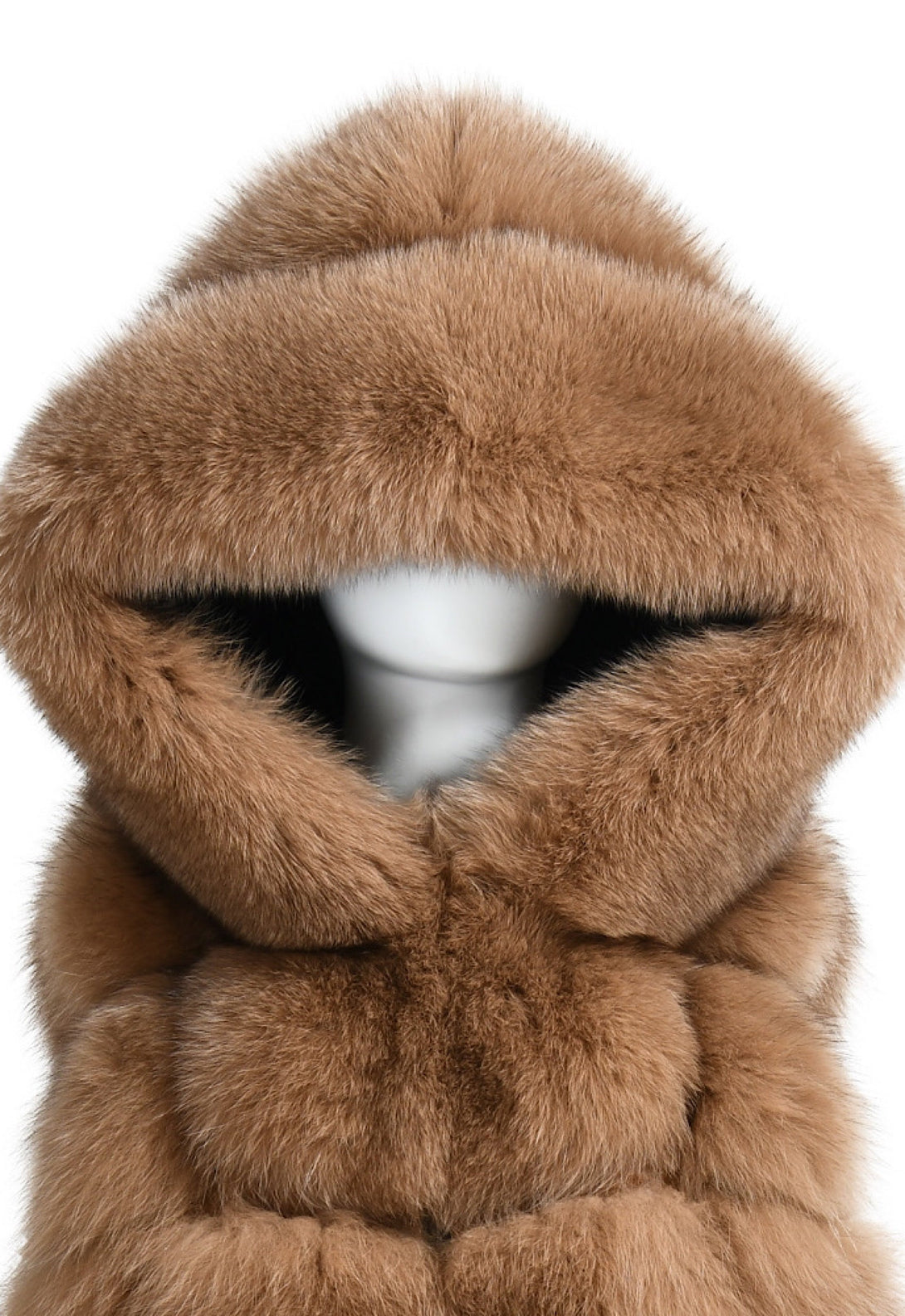 Close up of a fox fur hooded vest for woman showcasing high quality. 