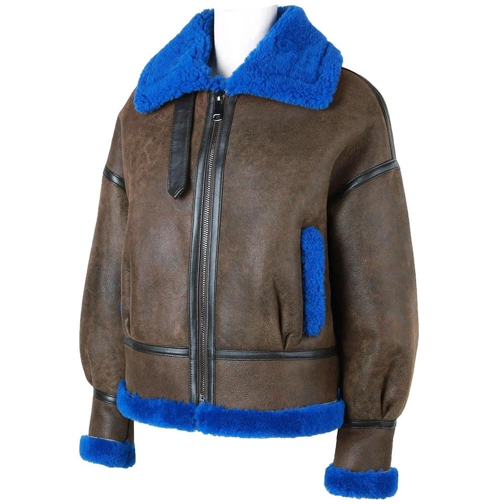 This brown and blue shearling leather jacket offers both warmth and sophistication, making it a perfect choice for colder days.